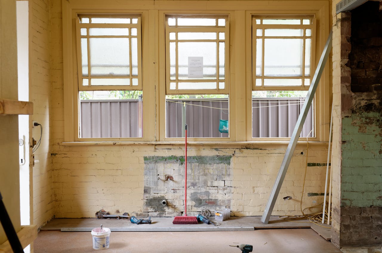 creative-02 An empty room featuring large windows, ready for renovation in Sydney, Australia.